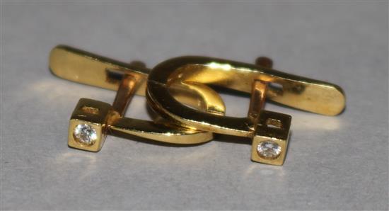 A pair of 18ct gold and diamond set earrings.